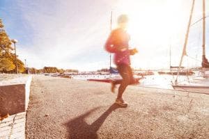 someone running along the water in helsinki