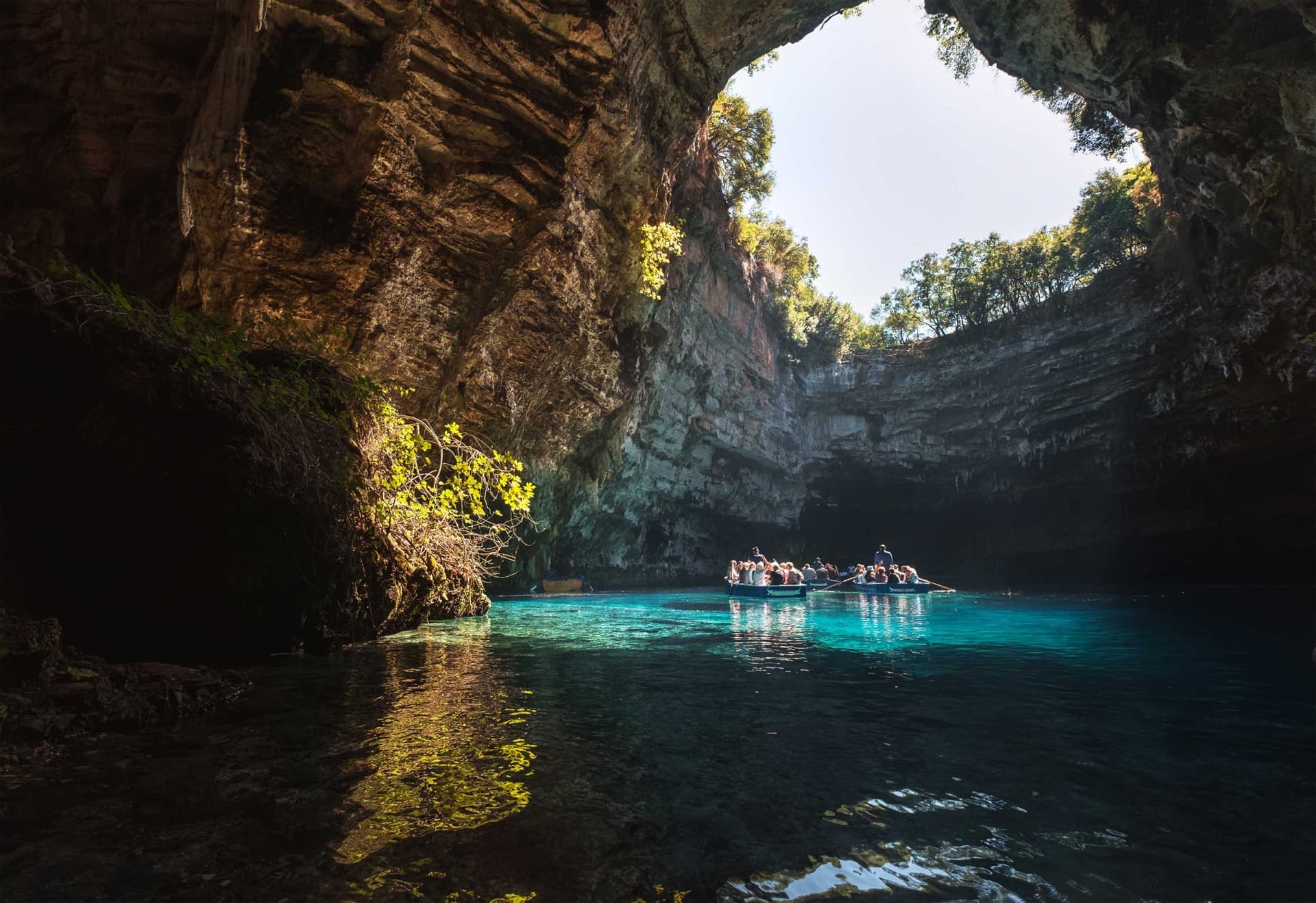 Light filters in to a cave in Sami, Greece, where visitors swim. 