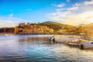 Island of Elba, bay of the village of Rio Marina. Beach of the bay and lighthouse. Tuscany.