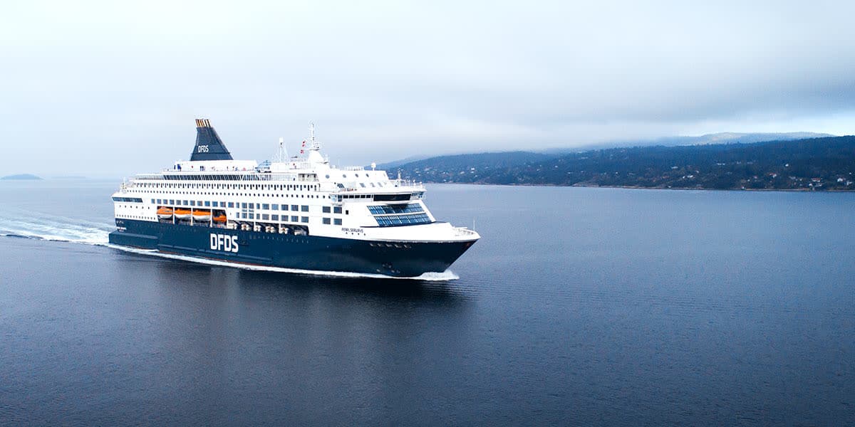 A DFDS ferry sailing through calm waters