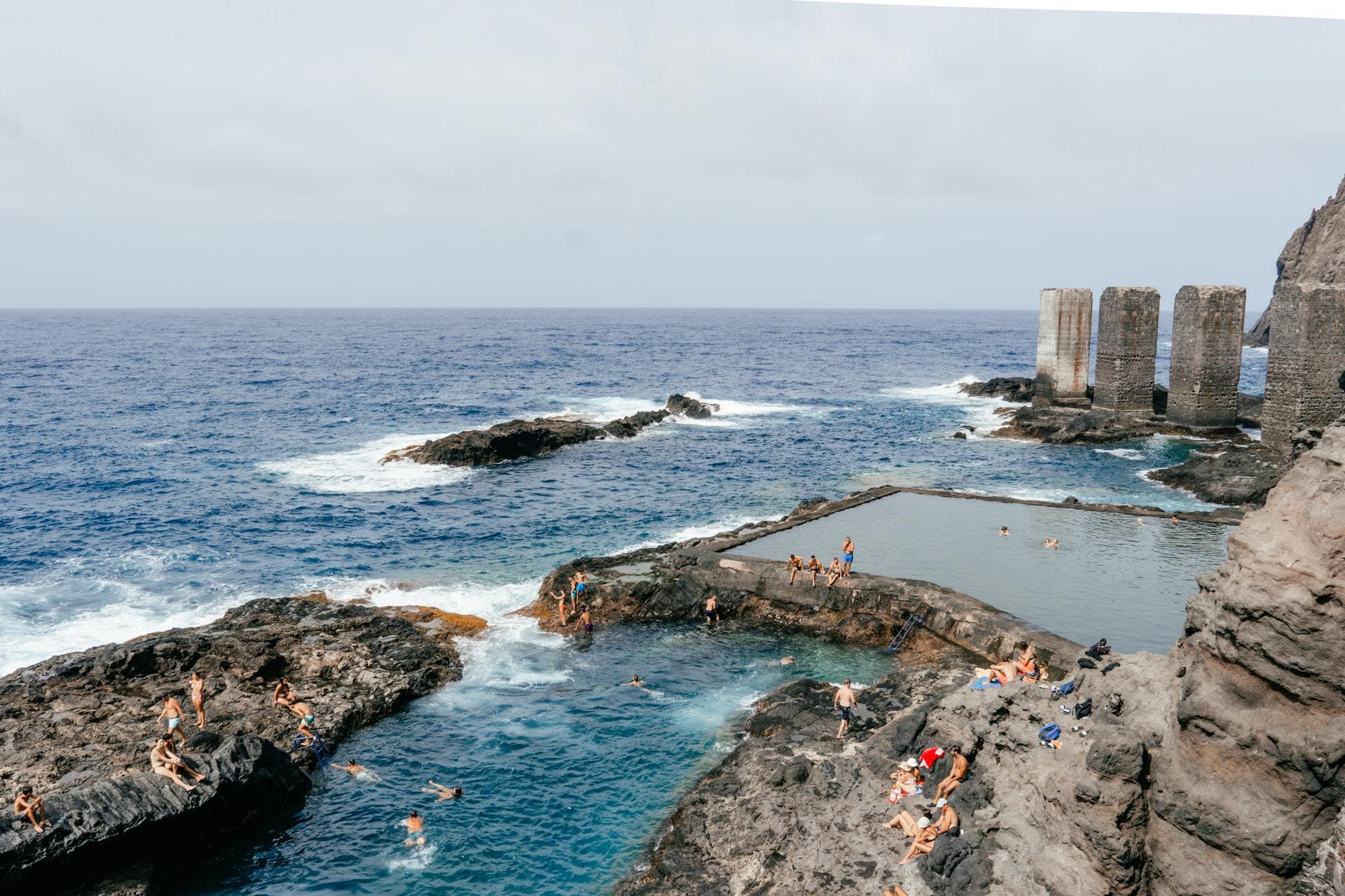 Natural pools and some tourists swimming in them