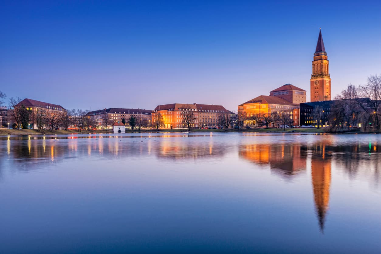 View over the Kleiner Kiel lake and Hiroshima park on the downtown and the landmark city hall of Kiel, the second largest city of Schleswig-Holstein, Germany.