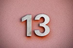 pink background with silver number 13