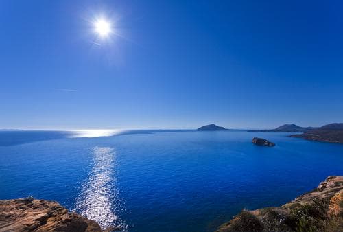 sun shining off the aegean sea