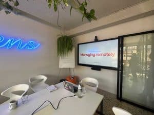 big screen in conference room at ferryscanner office during manager training session