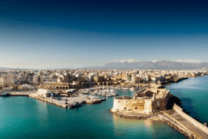 panoramic view of the old town of Heraklion with houses and at the end the famous castle