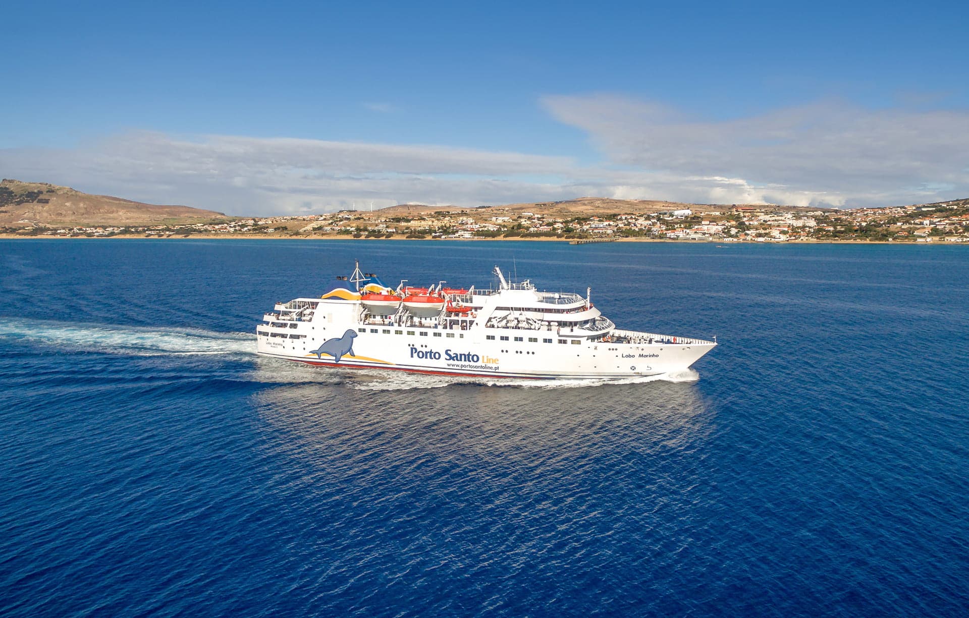 A large ferry from Porto Santo Line glides over quiet waters