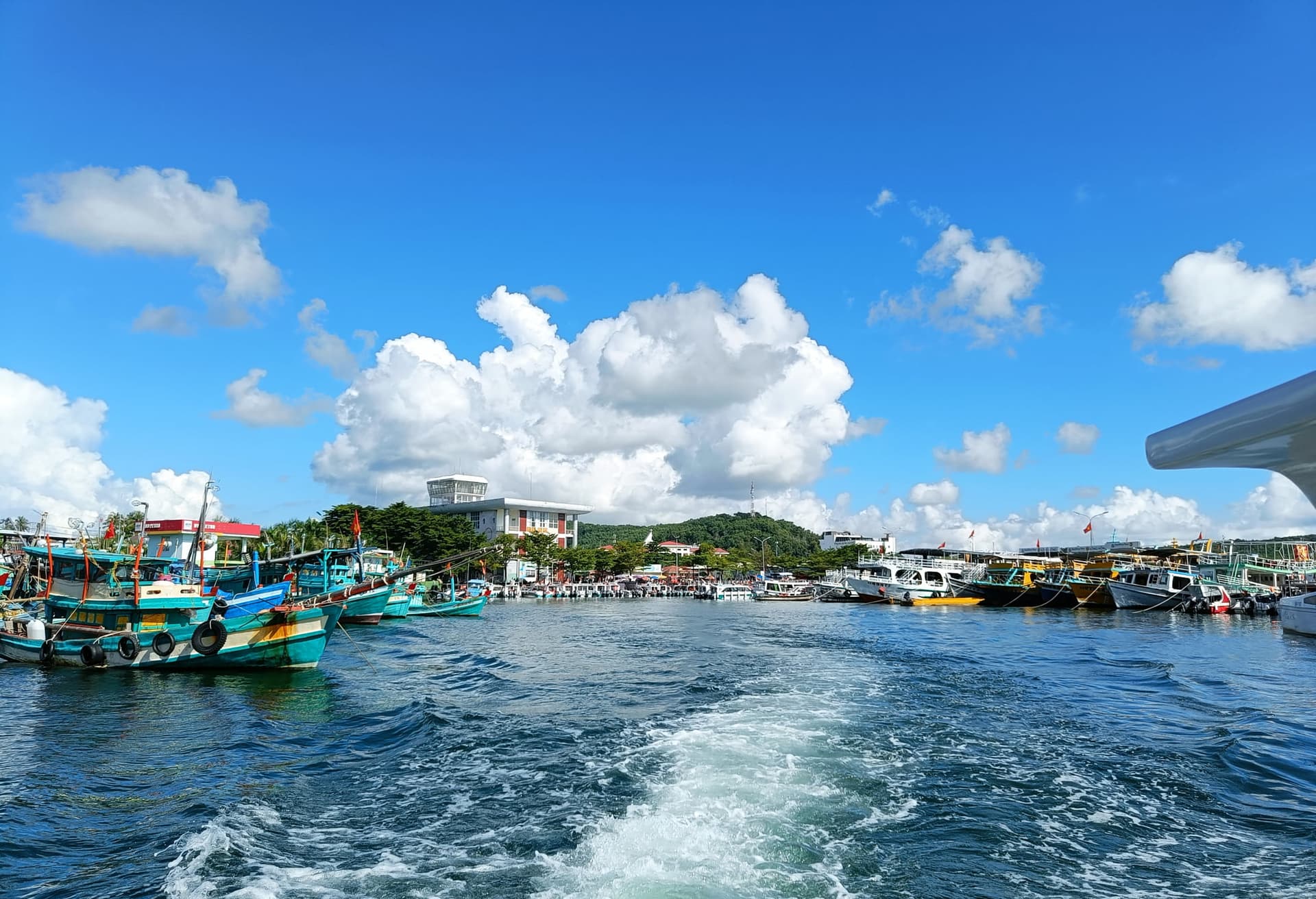 Phu Quoc ferry port with colourful vessels.