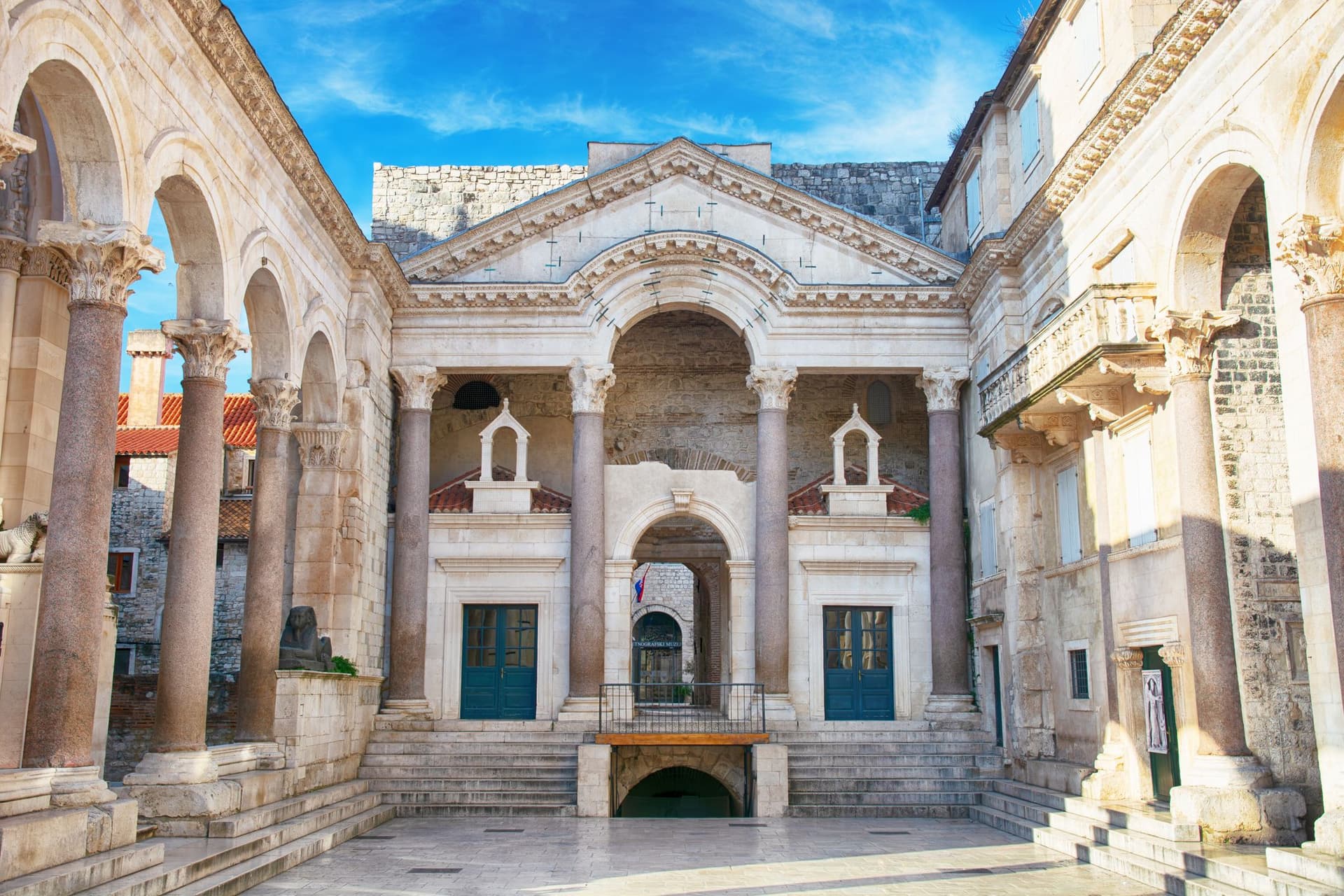 The Peristyle courtyard at the heart of Diocletian's Palace in Split, Croatia, its Roman columns glowing under a morning sky.